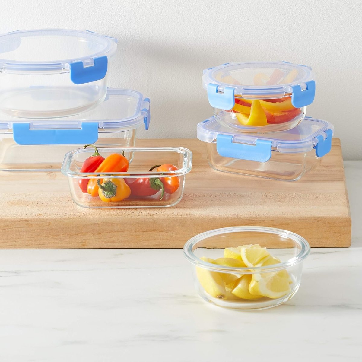 Amazon Basics Glass Food Storage Containers with Locking Lids, Set of 7, 14 pieces including lids, BPA - Free, clear with blue silicone ring - Homesidy.com